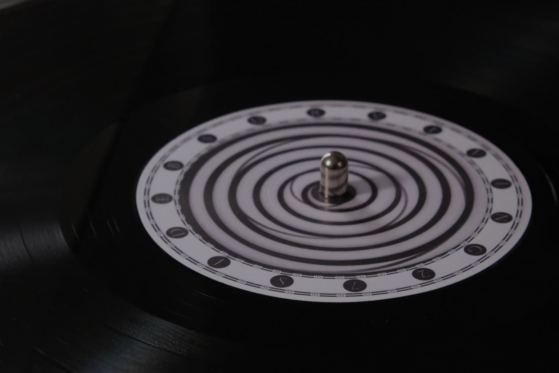 Close-up photograph of the Surviving 27 vinyl on a turntable